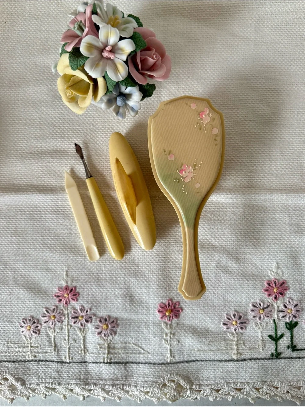 Celluloid child's hairbrush hand-painted floral design, circa 1920s-1930s